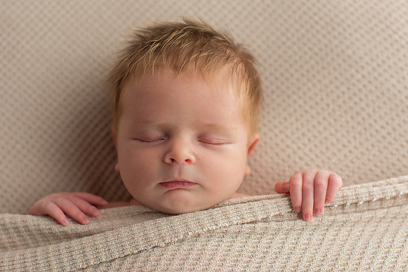 Newborn Baby Boy in Natural Sleeping Position