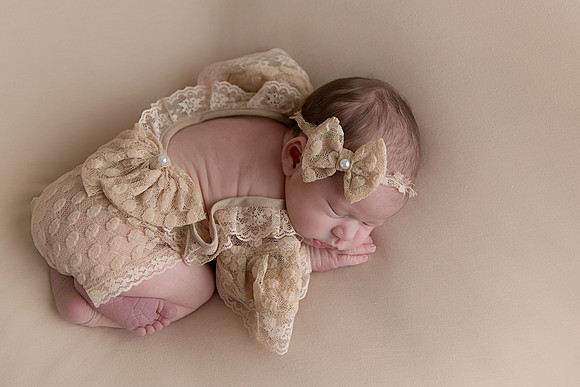 Newborn Baby Girl in Lace Romper & Headband Captured by Denver Colorado Photographer Donna Young