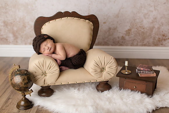 Newborn Baby Boy Posed in Chair Captured by Aurora Colorado Photographer Donna Young